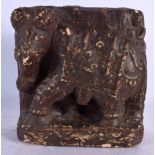 AN EARLY INDIAN POLYCHROMED STONE PLAQUE OF AN ELEPHANT modelled roaming. 18 cm x 21 cm.