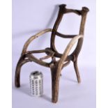 A RARE CHILDS TAXIDERMY CARVED ANTLER CHAIR. 45 cm x 23 cm.