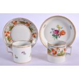 TWO 19TH CENTURY CONTINENTAL PORCELAIN CUPS AND SAUCERS painted with flowers. 10 cm diameter. (4)