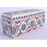 A RARE TURKISH OTTOMAN FAIENCE GLAZED DOCUMENT BOX AND COVER painted with flowers. 28 cm x 12 cm.