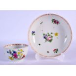 Bristol teabowl and saucer painted with flowers under a red chainlink border