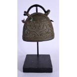 AN EARLY MIDDLE EASTERN TRIBAL BELL. 22 cm high.