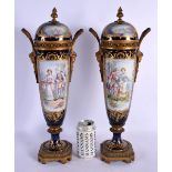 A LARGE PAIR OF 19TH CENTURY FRENCH SEVRES PORCELAIN VASES AND COVERS painted with figures and lands