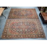 A FINE PAIR OF PERSIAN RUGS. 216 cm x 138 cm.