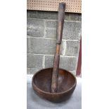 An early African Tribal carved wooden bowl and pounder 105 cm (2).