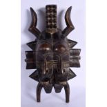 A VINTAGE AFRICAN TRIBAL CARVED WOOD MASK. 28 cm x 15 cm.