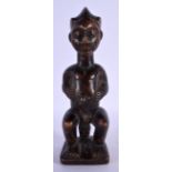 AN AFRICAN TRIBAL CARVED WOOD FERTILITY FIGURE. 24 cm high.