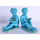 A PAIR OF 19TH CENTURY BLUE GLAZED TURQUOISE FIGURES Sevres or Minton.15 cm x 12 cm.