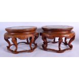 A PAIR OF EARLY 20TH CENTURY CHINESE HARDWOOD AND MARBLE STANDS. 21 cm x 24 cm.