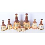 A collection of Wade Bells Scotch Whiskey bell decanters 25 cm (8).