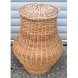 A large wicker laundry basket 65 x 46 cm .