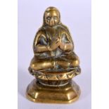 AN 18TH CENTURY INDIAN SOUTH EAST ASIAN BRONZE FIGURE OF A BUDDHA of miniature form. 6 cm x 3 cm.