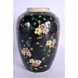 AN 18TH/19TH CENTURY CHINESE FAMILLE NOIRE PORCELAIN JAR Kangxi style, painted with flowers. 19 cm x