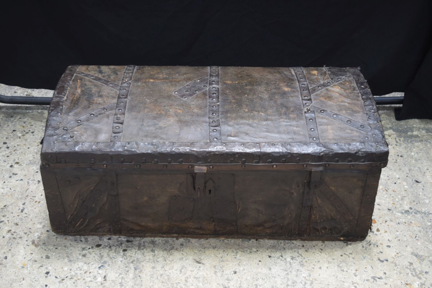 A 17/18th Iron bound wooden and leather trunk 39 x 95 x 48 cm.
