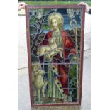 A framed leaded religious themed stain glass panel (Provenance Guildford Cathedral )142 x 74 cm.