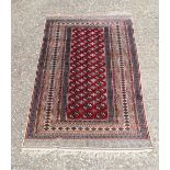 A red ground Persian rug 194 x 126 cm.