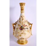 ROYAL WORCESTER TWO HANDLED VASE PAINTED WITH A MULTI COLOURED BIRD IN A GILT TREE SHAPE 982 DATE MA