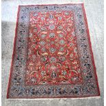 A red ground Persian rug 183 x 142 cm.