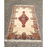 A thick pile Ivory ground Kerman Rug 214 x 137 cm