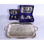 A LARGE SILVER PLATED TRAY together with two boxed sets. Largest 52 cm x 34 cm.