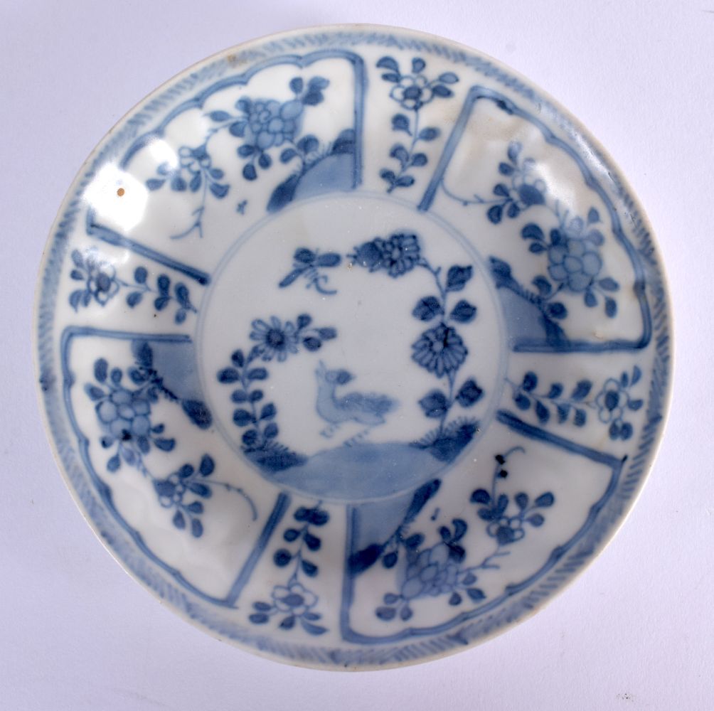 A LARGE 17TH/18TH CENTURY CHINESE CA MAU BLUE AND WHITE SAUCER painted with a bird and flowers. 11 c