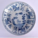 A LARGE 17TH/18TH CENTURY CHINESE CA MAU BLUE AND WHITE SAUCER painted with a bird and flowers. 11 c
