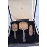 A BOXED FOUR PIECE SILVER DRESSING TABLE SET. Birmingham 1965 & 1968. 575 grams overall. Largest 29