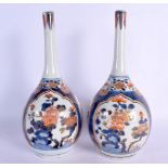 A PAIR OF 18TH CENTURY JAPANESE EDO PERIOD IMARI PORCELAIN VASES painted with foliage and vines. 25