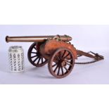 AN ANTIQUE BRONZE CANNON upon a wooden support. 55 cm x 24 cm.