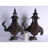A LARGE PAIR OF 19TH CENTURY JAPANESE MEIJI PERIOD BRONZE BIRD CENSERS AND COVERS decorated with mot