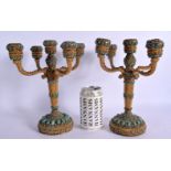 A VERY UNUSUAL PAIR OF EARLY 20TH CENTURY YELLOW METAL TURQUOISE AND CORAL CANDLE STICKS decorated a
