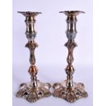 A PAIR OF EARLY 19TH CENTURY OLD SHEFFIELD PLATED CANDLESTICKS formed with acanthus. 25 cm high.