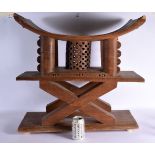 A RARE LARGE EARLY 20TH CENTURY AFRICAN TRIBAL DOUBLE HEAD REST with X cross frame. 65 cm x 62 cm.