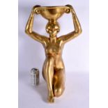 A 1950S GILT PAINTED PLASTER FIGURE OF A FEMALE modelled holding aloft a vase. 53 cm x 28 cm.