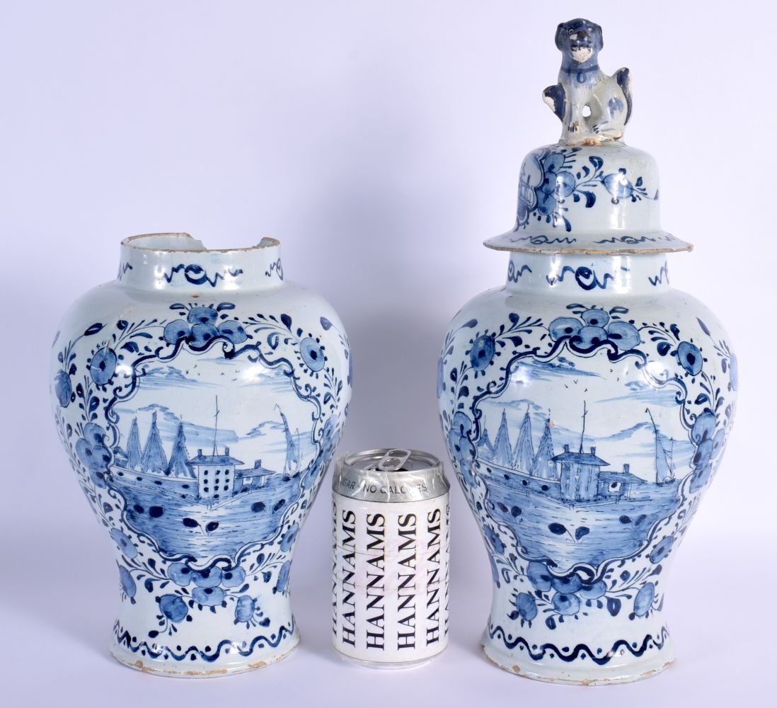 A PAIR OF 19TH CENTURY DELFT BLUE AND WHITE TIN GLAZED VASES AND COVERS painted with ships and lands