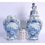 A PAIR OF 19TH CENTURY DELFT BLUE AND WHITE TIN GLAZED VASES AND COVERS painted with ships and lands