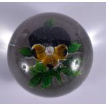 AN ANTIQUE FRENCH SINGLE FLOWER PAPERWEIGHT. 5.5 cm wide.