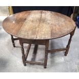 An 18/19th Century Gate leg table with a drawer on one aspect 75 x 128 x 116 cm.