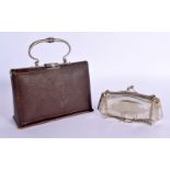 A CHARMING EARLY 20TH CENTURY LEATHER MINIATURE HAND BAG forming an etui, together with a white meta