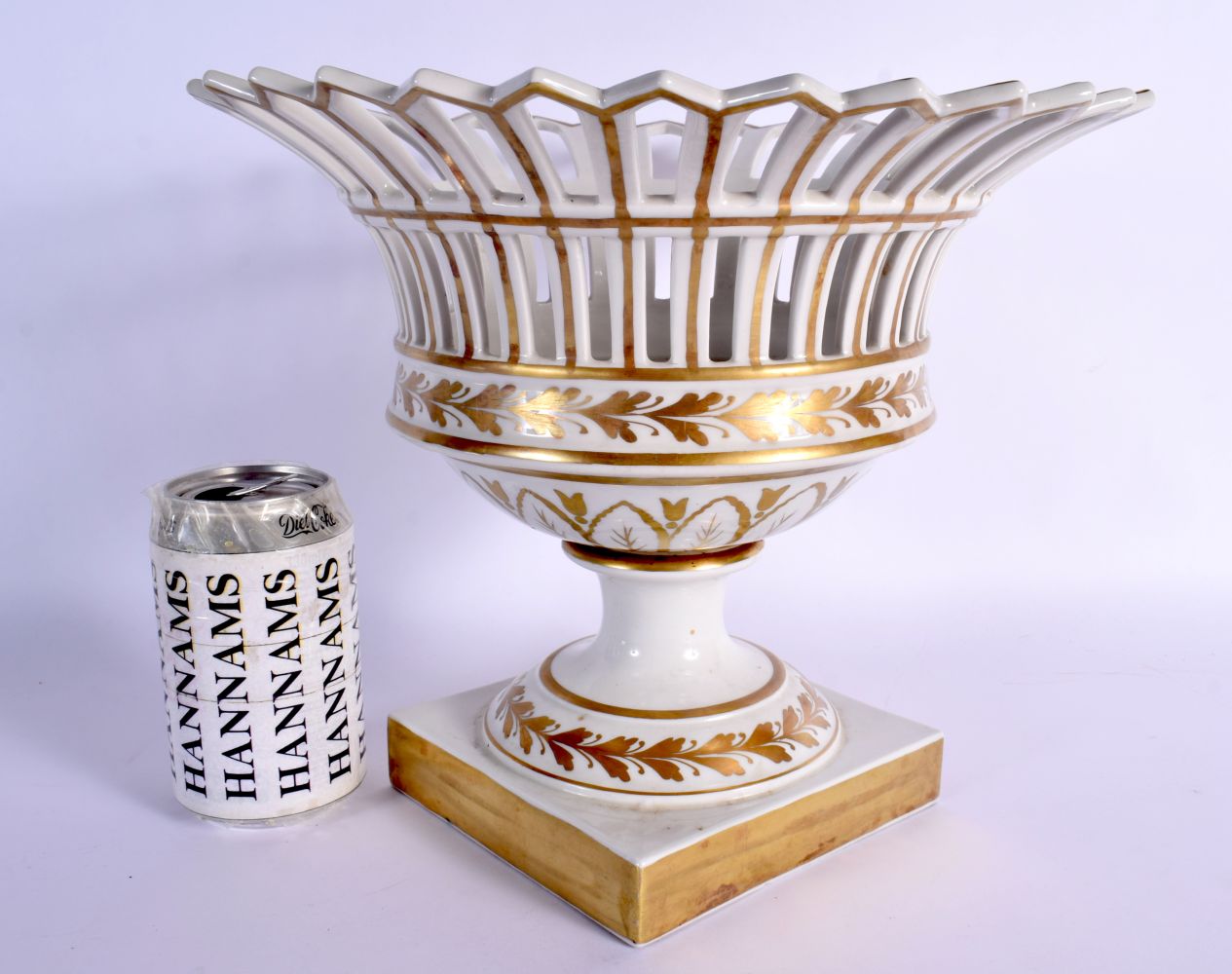 A LATE 19TH FRENCH GILT AND WHITE PORCELAIN PEDESTAL COMPORT painted with gilt sprays. 26 cm x 26 cm