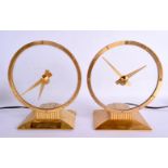 A RETRO PAIR OF 1970S PRESENTATION BRASS ATMOS TYPE CLOCKS. 18 cm x 23 cm.