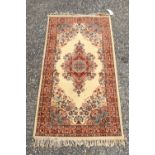 A Persian Ivory ground rug 186 x 90 cm.