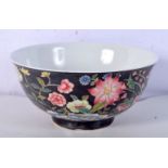 A Chinese porcelain Famille Noir bowl decorated with foliage and flower 8 x 15cm.