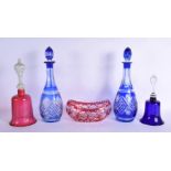 A PAIR OF BOHEMIAN BLUE FLASH DECANTERS with stoppers, together with a vase & bells. Largest 34 cm h