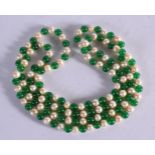 A JADE AND PEARL NECKLACE. Length 180cm, bead size 7.8mm, weight 103g