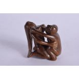 AN EROTIC JAPANESE NETSUKE. 4.2cm x 4.2cm x 3.2cm, weight 29.4g