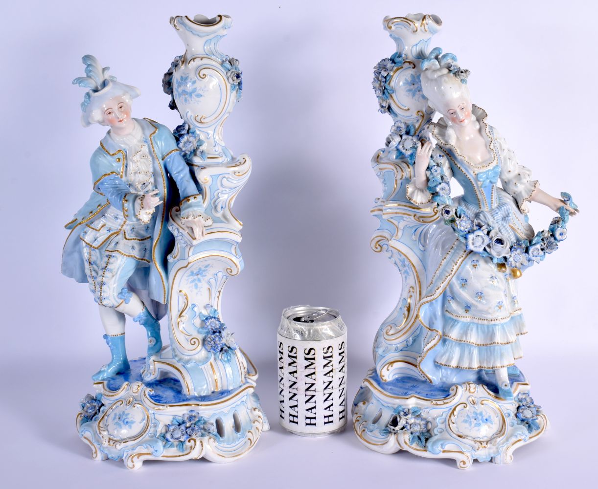 A GOOD LARGE PAIR OF 19TH CENTURY GERMAN BLUE AND WHITE PORCELAIN FIGURES modelled as a female and f