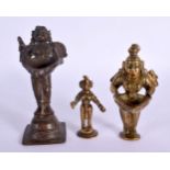 THREE 18TH/19TH CENTURY INDIAN BRONZE FIGURES OF BUDDHAS two with offering dishes. Largest 15 cm hig