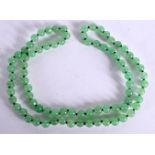 A JADE NECKLACE. Length 70cm, bead size 8mm, weight 59g