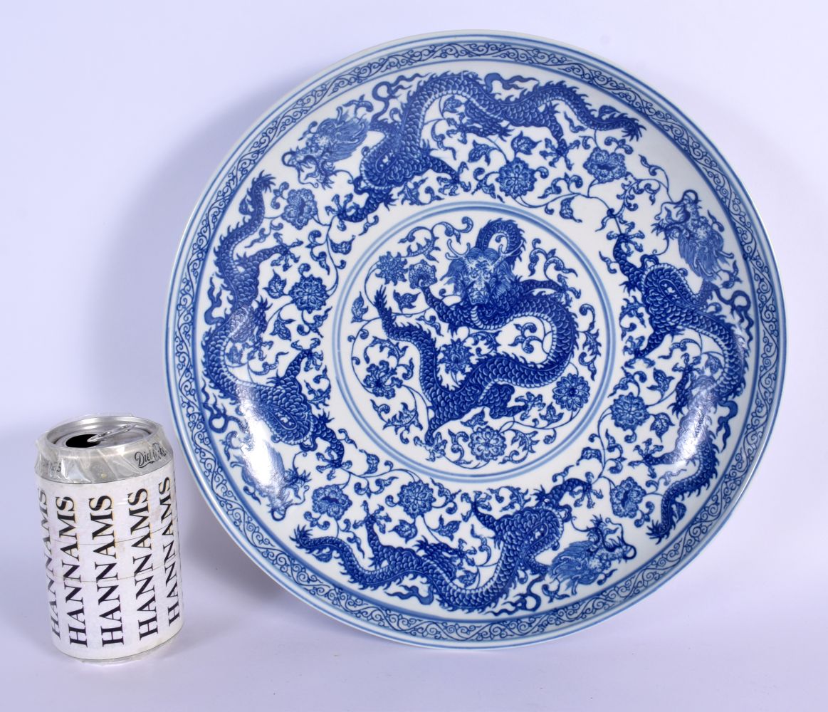 A LARGE CHINESE BLUE AND WHITE PORCELAIN DRAGON DISH 20th Century, bearing Qianlong marks to base. 3